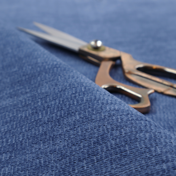 A deep royal blue or indigo fabric with a dense horizontal ribbed texture. The weave features a soft, plush pile that creates a multi-tonal effect with rich shadows and mid-tone blue highlights across the linear ridges.