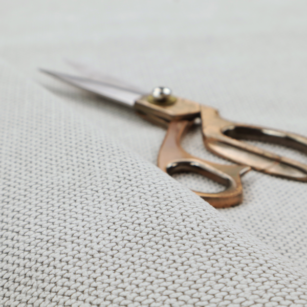 A premium light grey or off-white waffle-knit fabric, featuring a crisp, structured, and sophisticated honeycomb texture.