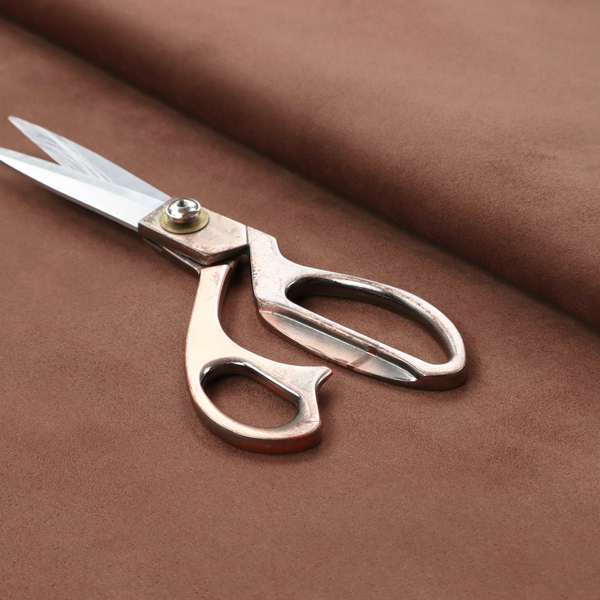 Annecy Water Repellent Velvet in Terracotta. The fabric features a dense, plush pile with a soft matte finish in a warm, muted clay-red tone. This high-performance upholstery material offers a luxurious feel combined with a specialized water-resistant coating for lasting durability.