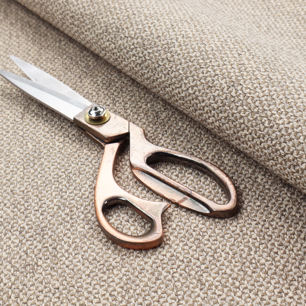 This fabric features a tight, structured basket weave in a sophisticated blend of cool taupe, grey, and off-white yarns.