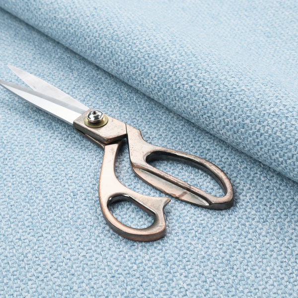 This fabric features a tight, structured basket weave in a soft, airy powder blue.