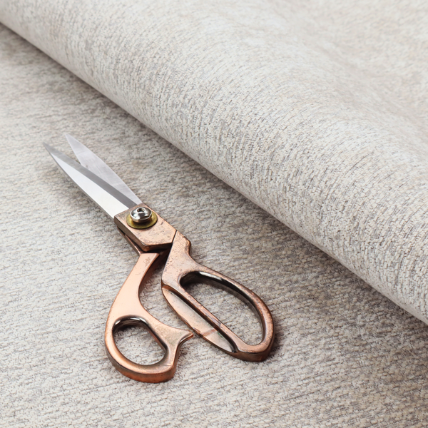 A sophisticated, two-tone textured weave that blends cool grey and soft cream yarns.
