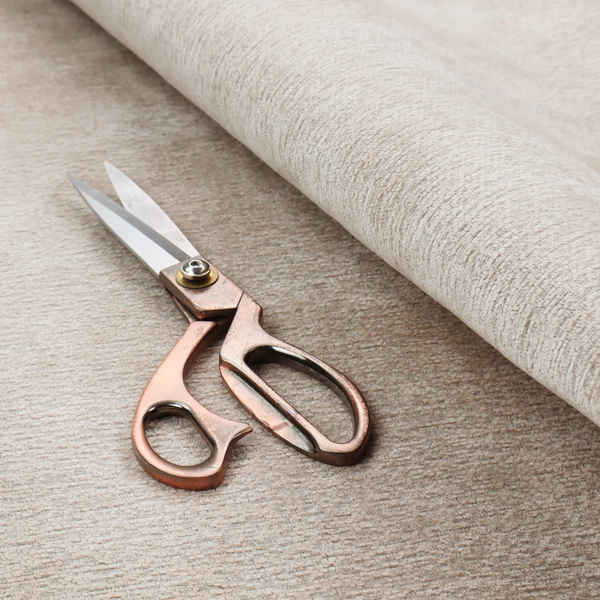 A warm, earthy neutral weave that masterfully blends light cream, tan, and soft grey tones. It has a complex, nubby texture with an intricate, multidimensional surface that feels both substantial and inviting.