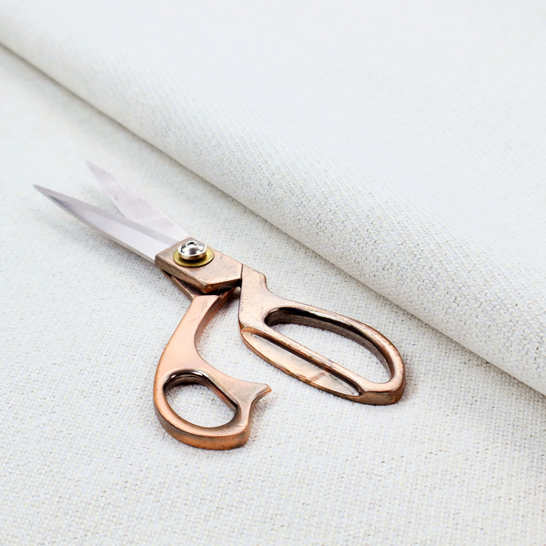 A white woven upholstery fabric with a subtle, textured grain.