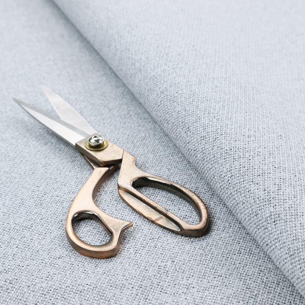 A very pale, cool grey with crisp white and charcoal flecks; bright and airy.