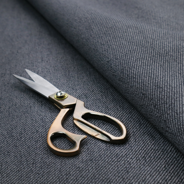 A charcoal grey upholstery fabric with a dense, diagonal twill weave.