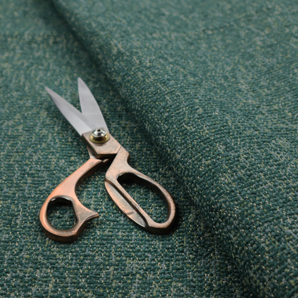 A multi-tonal emerald and dark green textured woven fabric swatch.
