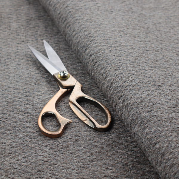 A dark grey, textured upholstery fabric.