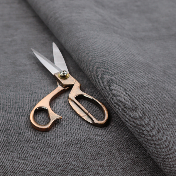 A finely textured weave in a deep charcoal, graphite, or dark slate grey shade. The material features a subtle heathered look with finely blended threads of black, deep grey, and soft ash undertones throughout.