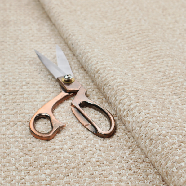 The material features a dense, multi-toned neutral weave with a warm beige and oatmeal base, intricately interlaced with horizontal flecks of crisp white threads throughout.