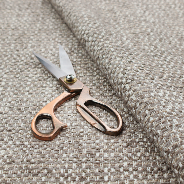 The material features a dense, multi-toned weave with a cool taupe and light brown base, intricately interlaced with horizontal flecks of cream and off-white threads throughout.