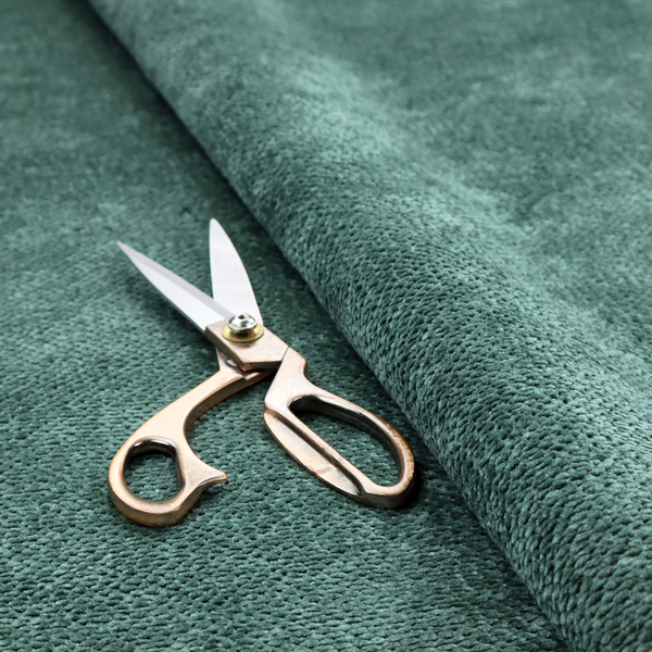 A deep, rich teal or blue-green upholstery fabric. It maintains the signature dense, uniform, boucle-style weave of the collection, composed of small, looped, and nubby yarn fibres that create a soft and tactile surface.