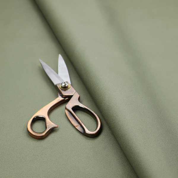 Plain, solid olive green-coloured Hallstatt faux leather fabric texture with a smooth, fine finish.