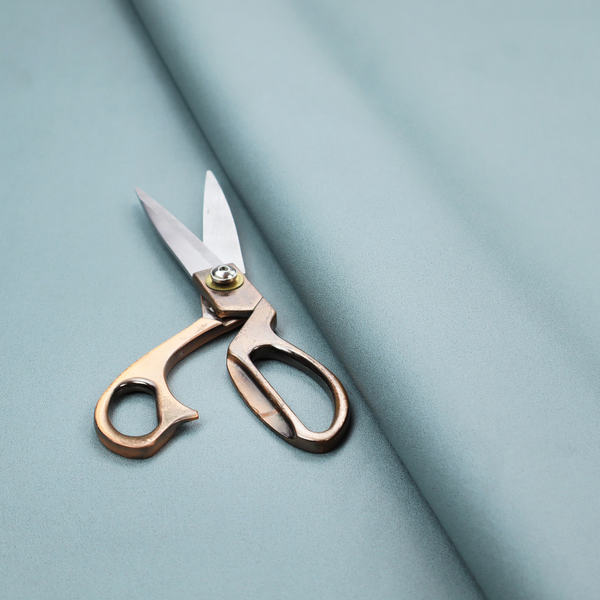 Plain, solid light blue-coloured Hallstatt faux leather fabric texture with a smooth, fine finish.