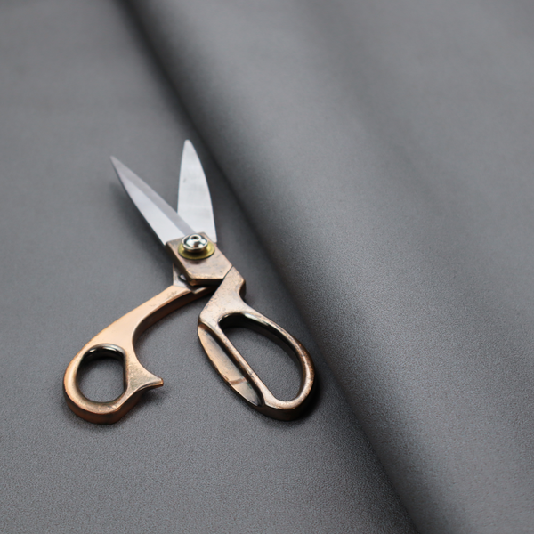 Plain, solid dark grey-coloured Hallstatt faux leather fabric texture with a smooth, fine finish.