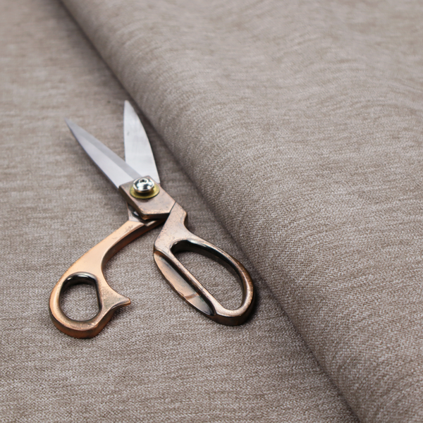 A solid light brown woven textile with a fine, subtle textured weave.