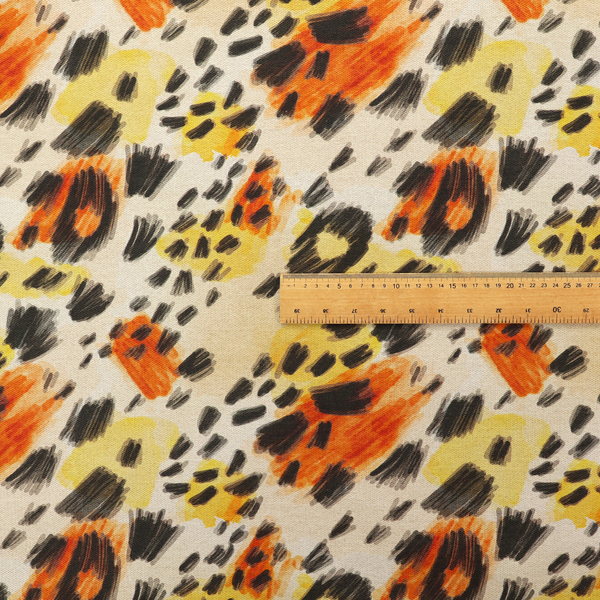 An abstract leopard print fabric featuring a light beige background with painterly, watercolour-style spots in shades of burnt orange, vibrant yellow, and charcoal black, accented with dashed, hand-drawn sketch lines.