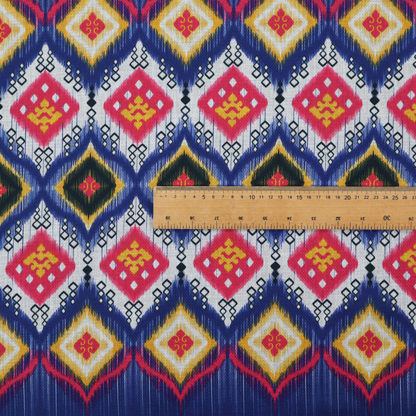 A high-energy textile with a large-scale geometric Ikat design. The pattern showcases concentric diamonds with feathered, "blurred" edges in electric blue, bright pink, and yellow, set against a background with vertical white striations.