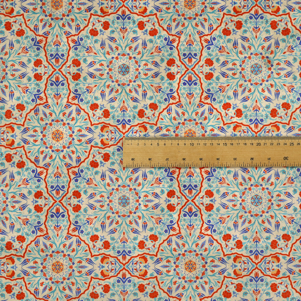 A decorative fabric with an Ottoman-style floral print. The design consists of repeating cobalt blue and turquoise tulips and deep red carnations intertwined with long, curving green leaves. The pattern mimics 16th-century Mediterranean ceramic tile art.