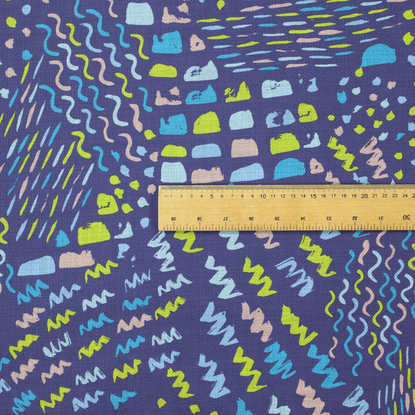 A dense abstract pattern featuring a variety of hand-drawn squiggles, dots, and dashes in bright, contrasting tones scattered across a deep, dark-coloured textured fabric.