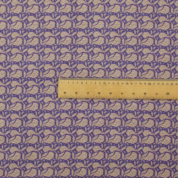 A dense, intricate upholstery fabric featuring a traditional paisley teardrop pattern with delicate ornamental linework repeating across a deep, dark-toned background.