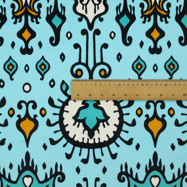 A symmetrical folk-art pattern featuring large ornamental medallions and vertical tribal motifs with feathered, ikat-inspired edges on a solid, light-toned background.