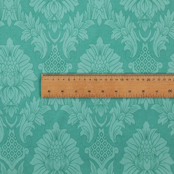 Vibrant teal damask fabric featuring a large-scale, repeating floral and acanthus leaf pattern in a tonal, monochromatic seafoam green colourway.