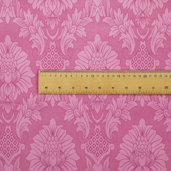 Vibrant magenta damask fabric featuring a large-scale, repeating floral and acanthus leaf pattern in a tonal, hot pink colourway.
