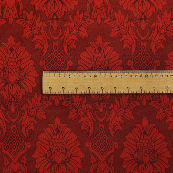 Deep burgundy damask fabric featuring a large-scale, repeating floral and acanthus leaf pattern in a dark, shimmering tonal colourway.