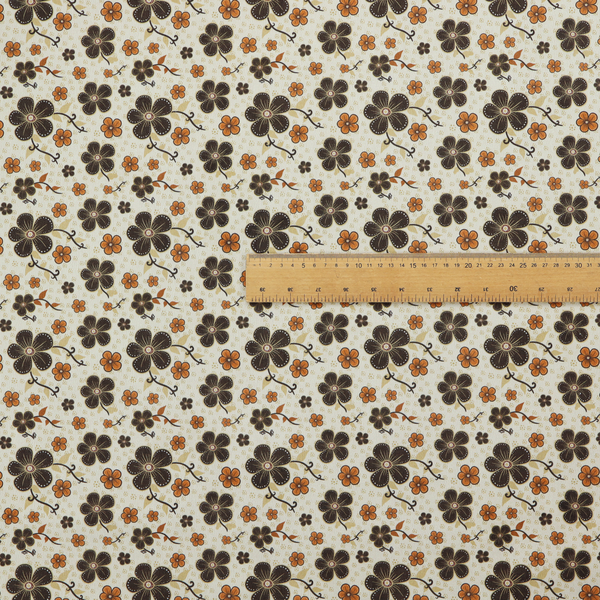 A light cream fabric featuring a repeating retro pattern of dark brown and orange flowers with scrolling vines.