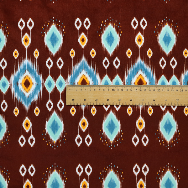 This fabric features a geometric, traditional-inspired ikat pattern set against a deep, rich chocolate-brown background.