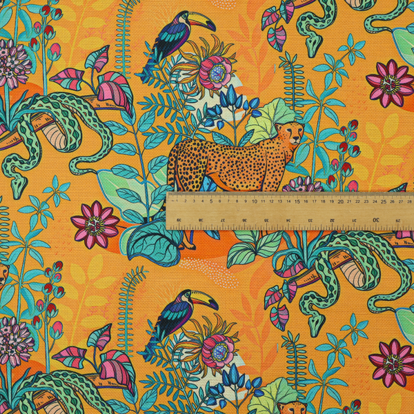 This vibrant, maximalist fabric features a stylized jungle motif set against a bold, warm orange background.