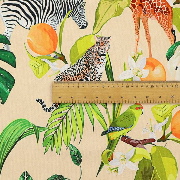 A playful jungle pattern featuring zebras, giraffes, leopards, parrots, and citrus fruits among lush green leaves on a cream-colored background.