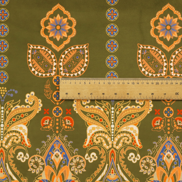 An intricate, bohemian-inspired pattern featuring ornate paisley motifs and stylized floral medallions in warm ochre, terracotta, and cerulean blue on a rich olive green background.