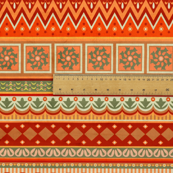 A vibrant, tribal-inspired geometric pattern featuring horizontal bands of zig-zags, floral tiles, and ornamental borders in a warm palette of terracotta, burnt orange, and sage green.