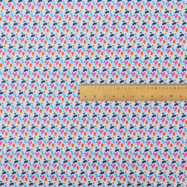 This fabric features a playful, confetti-inspired terrazzo pattern set against a light grey, speckled background.