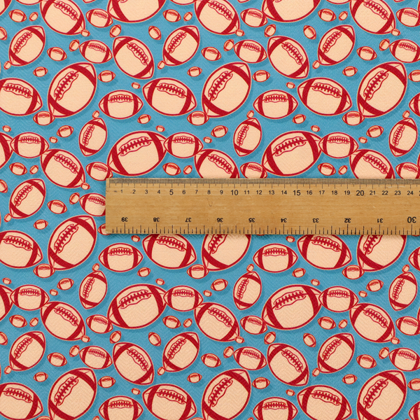 A vibrant blue fabric featuring a dense, repeating pattern of American footballs.