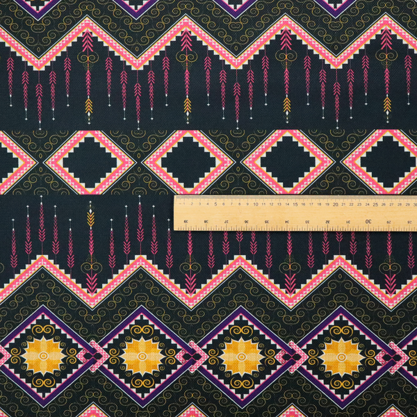 An intricate, repeating tribal fabric pattern set against a dark charcoal-black background, featuring horizontal bands of detailed geometric, ikat, and ornate line art motifs.