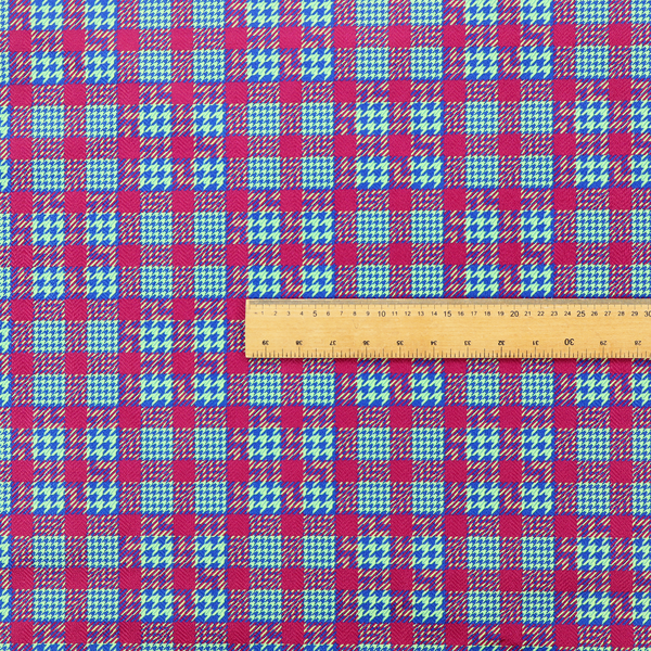 A dense, multi-coloured hounds tooth plaid pattern. The design features alternating blocks of bright magenta pink, electric royal blue, and neon lime green, interwoven into a structured, repetitive grid check with a classic textured twill appearance.