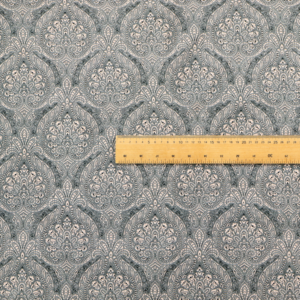 An intricate, repeating damask and paisley design on fabric, featuring elegant, symmetrical motifs.