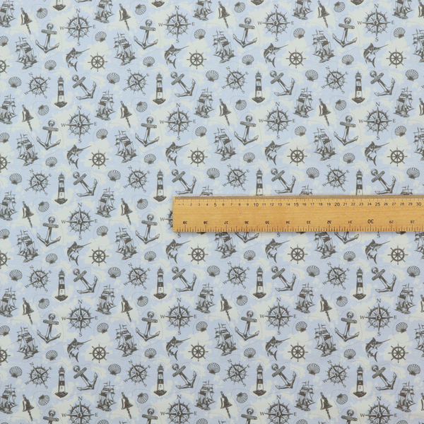 The pattern features a nautical-themed collage consisting of lighthouses, sailing ships, anchors, compasses, compass roses, seashells, ship bells, and marlin fish.