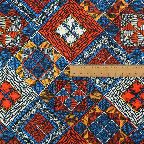 A geometric African wax print fabric featuring an intricate repeating pattern of nested diamonds, squares, and triangular motifs.