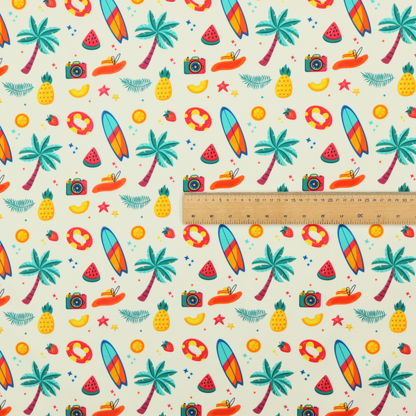 A playful summer pattern of surfboards, palm trees, pineapples, and cameras on a light background.