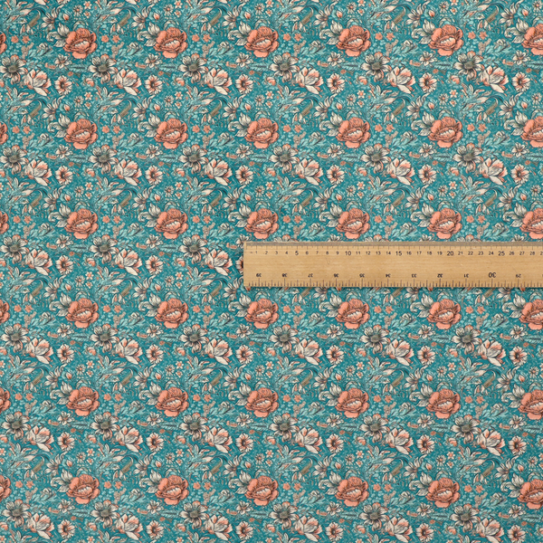 A dense, vintage-style floral repeating pattern featuring peach and muted white flowers with detailed leaves and foliage against a vibrant teal background.