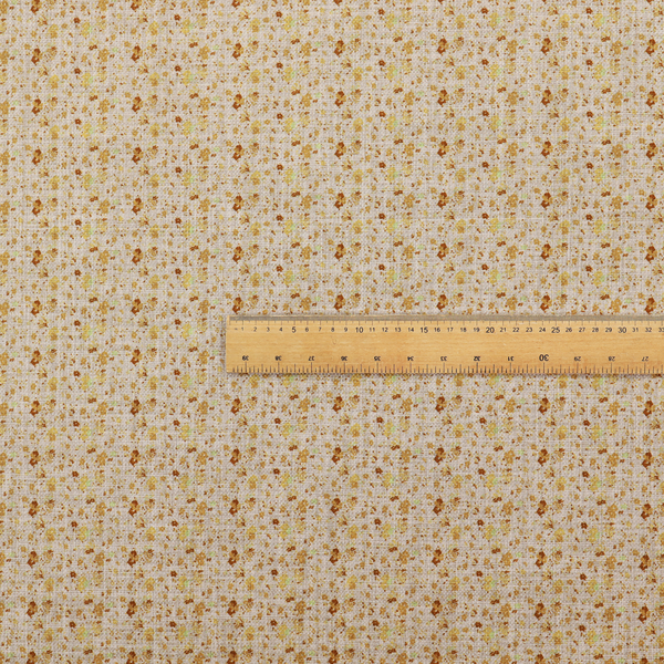 Textured light beige or cream fabric featuring a dense repeating pattern of tiny gold, yellow, and brown micro flowers.