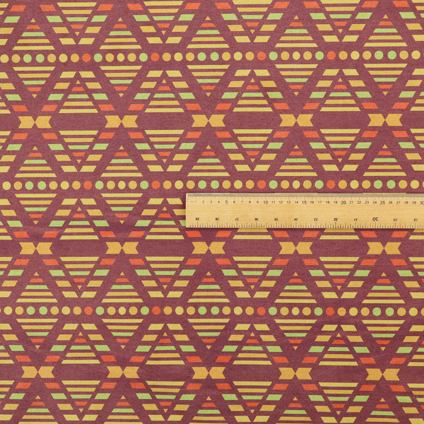 The image features a structured, geometric textile pattern with an Aztec-inspired aesthetic and repeated diamond motifs.