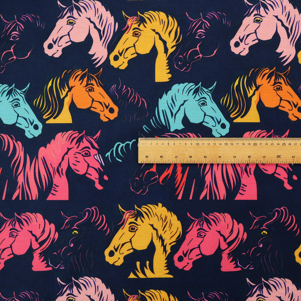 Vibrant repeating pattern of stylized horse heads in teal, orange, pink, and yellow set against a dark navy blue background.