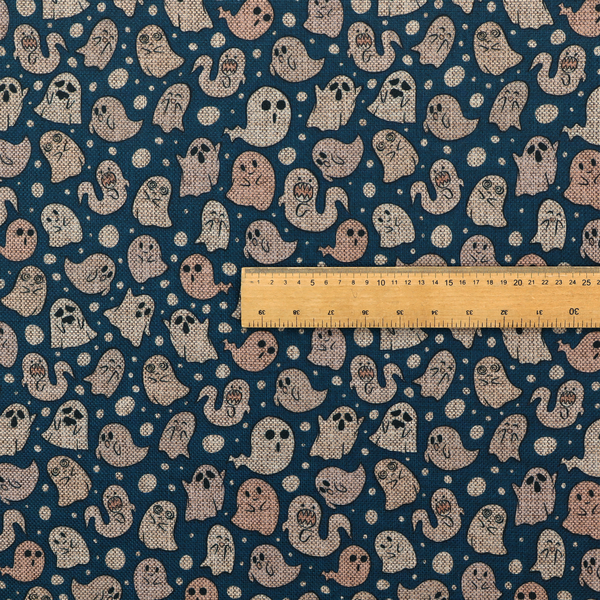 A dark blue fabric patterned with an all-over, repeating design of light beige and peach cartoon ghosts with various cute and silly facial expressions, interspersed with small white polka dots.