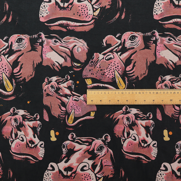 A dark grey fabric patterned with hand-drawn illustrations of hippos featuring an organic style.