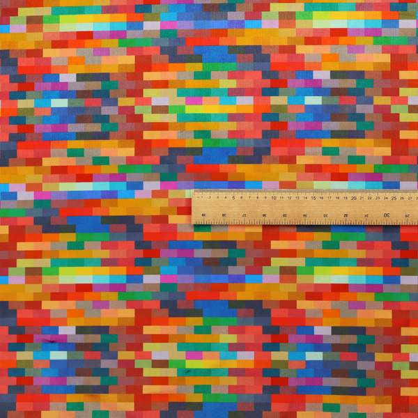 The image features a colourful, mosaic-like pattern made up of small, horizontal rectangular blocks in a wide variety of bright colours, including red, orange, yellow, blue, green, and purple.